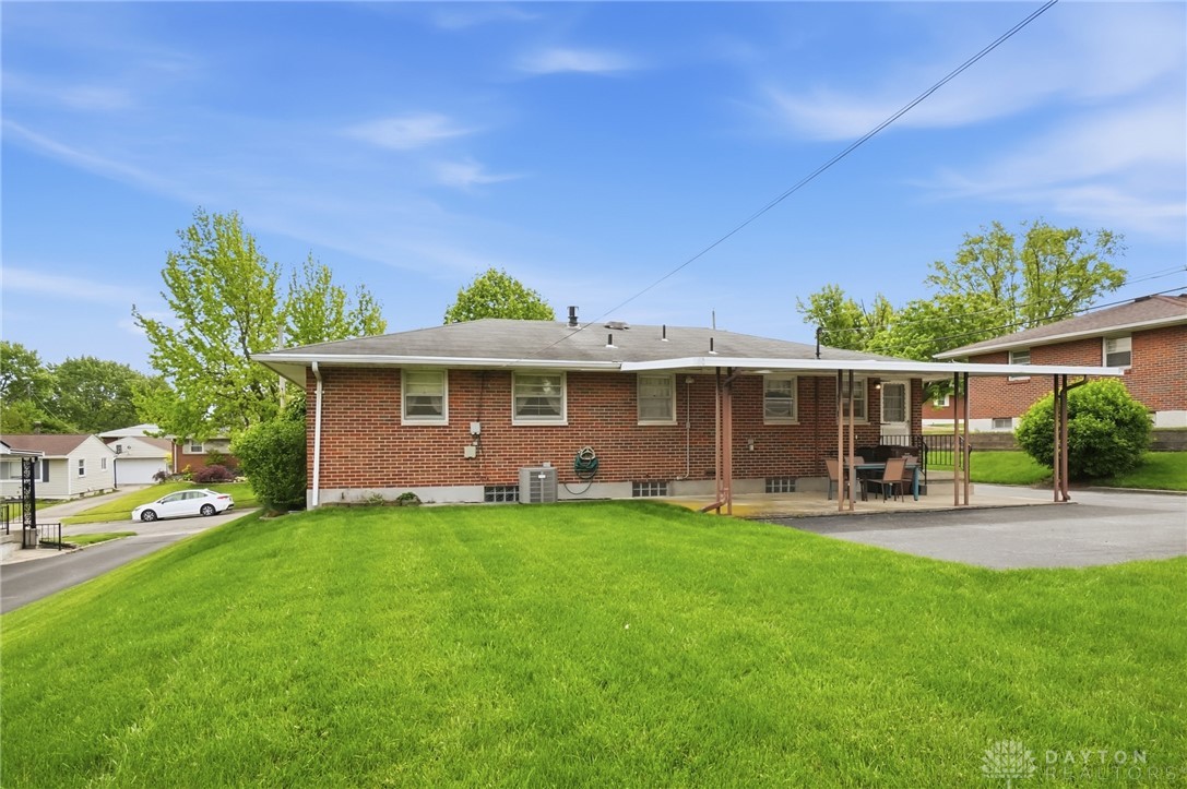 877 Woodhill Road Riverside, OH 45431 - Photo 33 of 42 This charming brick home offers a spacious yard and convenient covered parking.