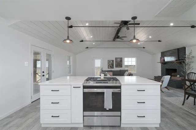 a kitchen with a stove and a table