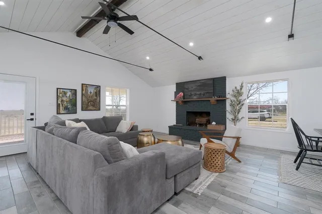 a living room with furniture and a fireplace