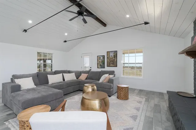a living room with furniture and a window