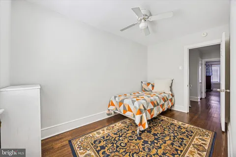 a bedroom with bed and a window