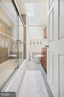 a spacious bathroom with a tub and shower