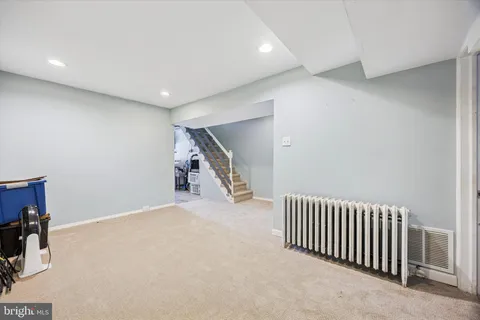 a view of an empty room with stairs