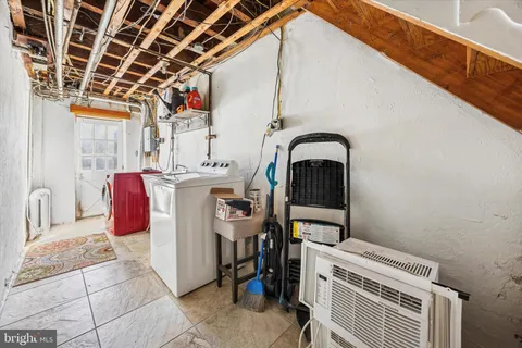 a view of a storage & utility room with washer and dryer