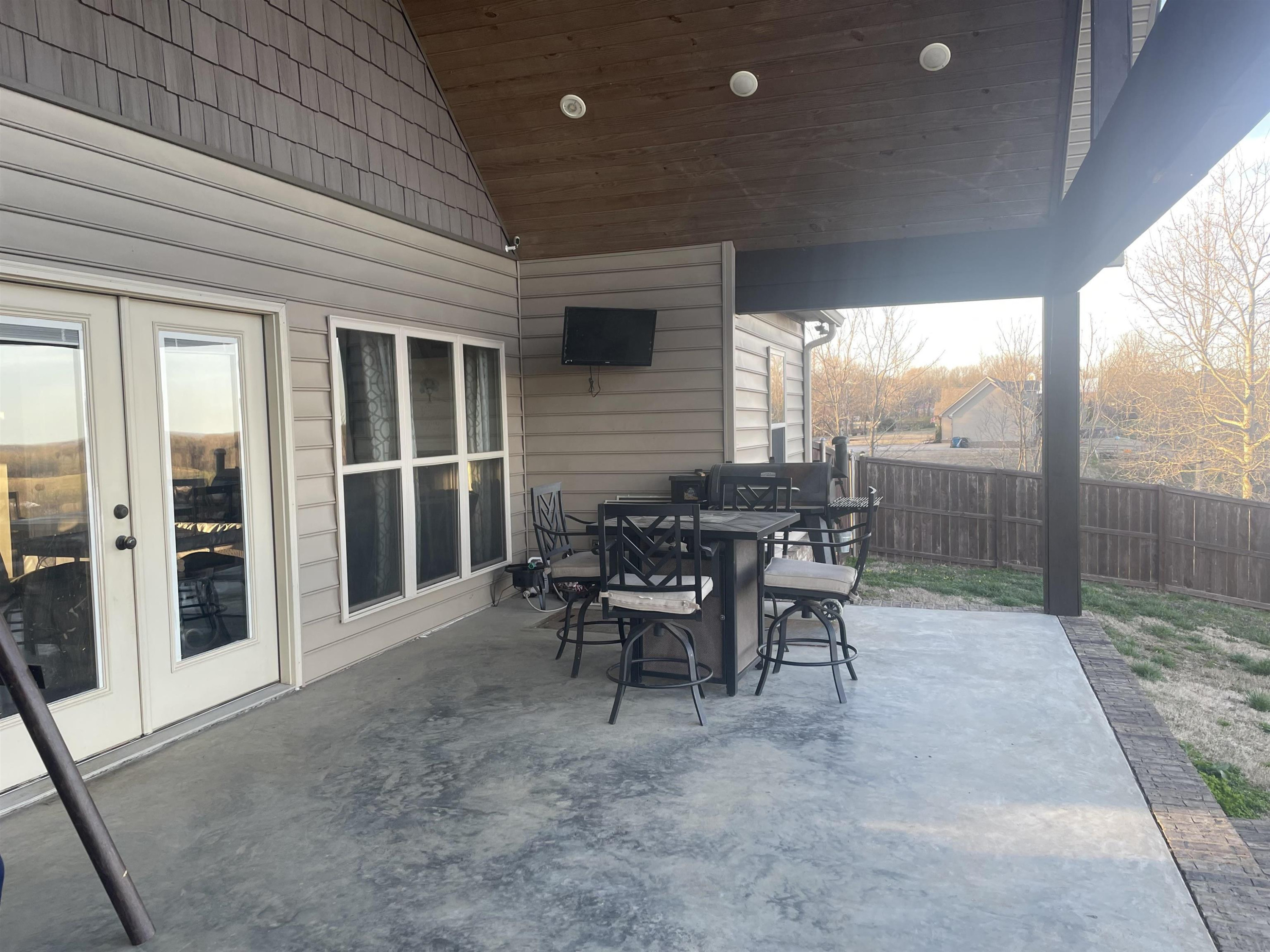 2680 Meacham Road Newbern, TN 38059 - Photo 13 of 13 a view of a porch with furniture and floor to ceiling window