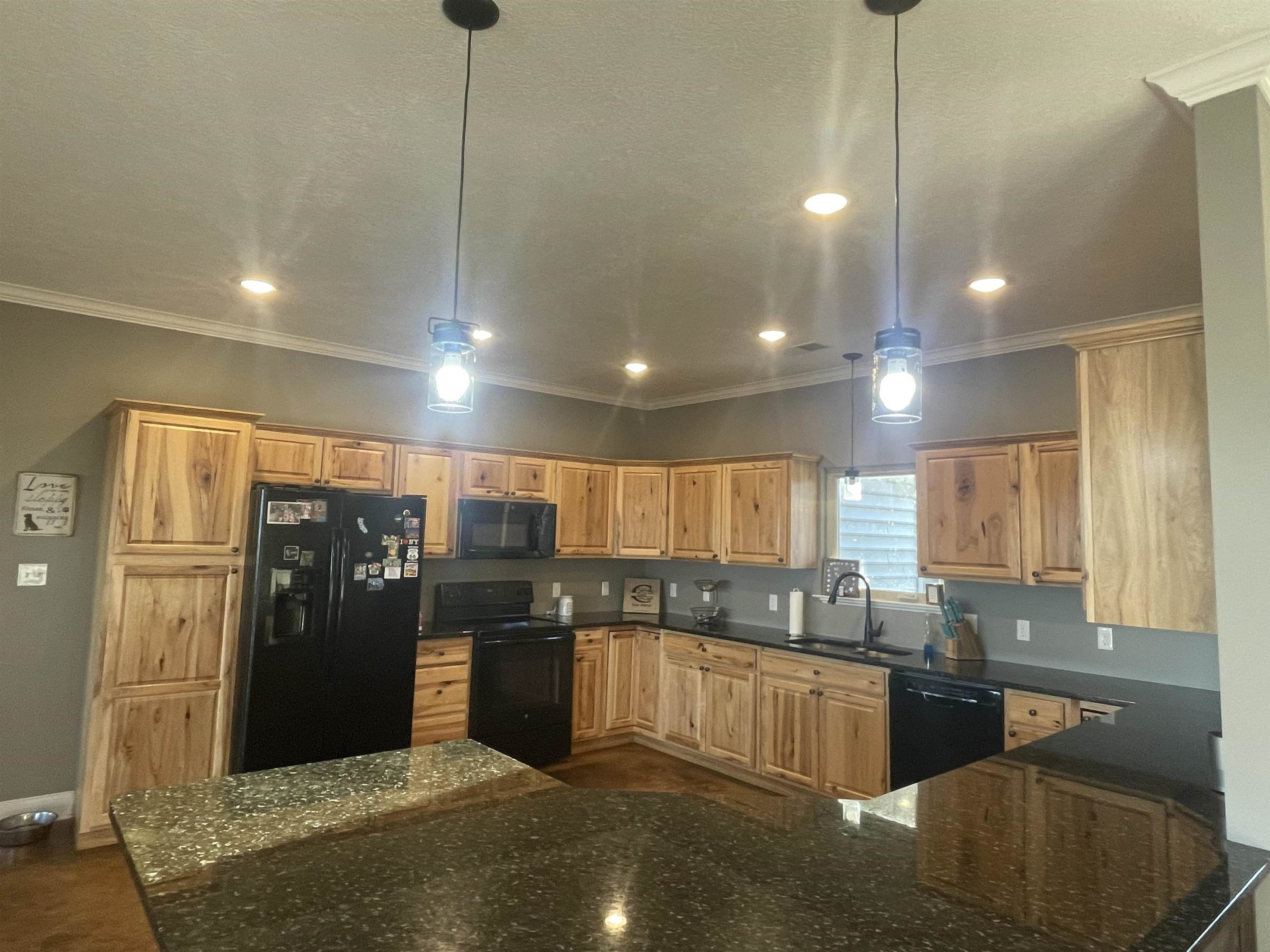 2680 Meacham Road Newbern, TN 38059 - Photo 6 of 13 a kitchen with stainless steel appliances granite countertop a refrigerator a sink a stove and oven