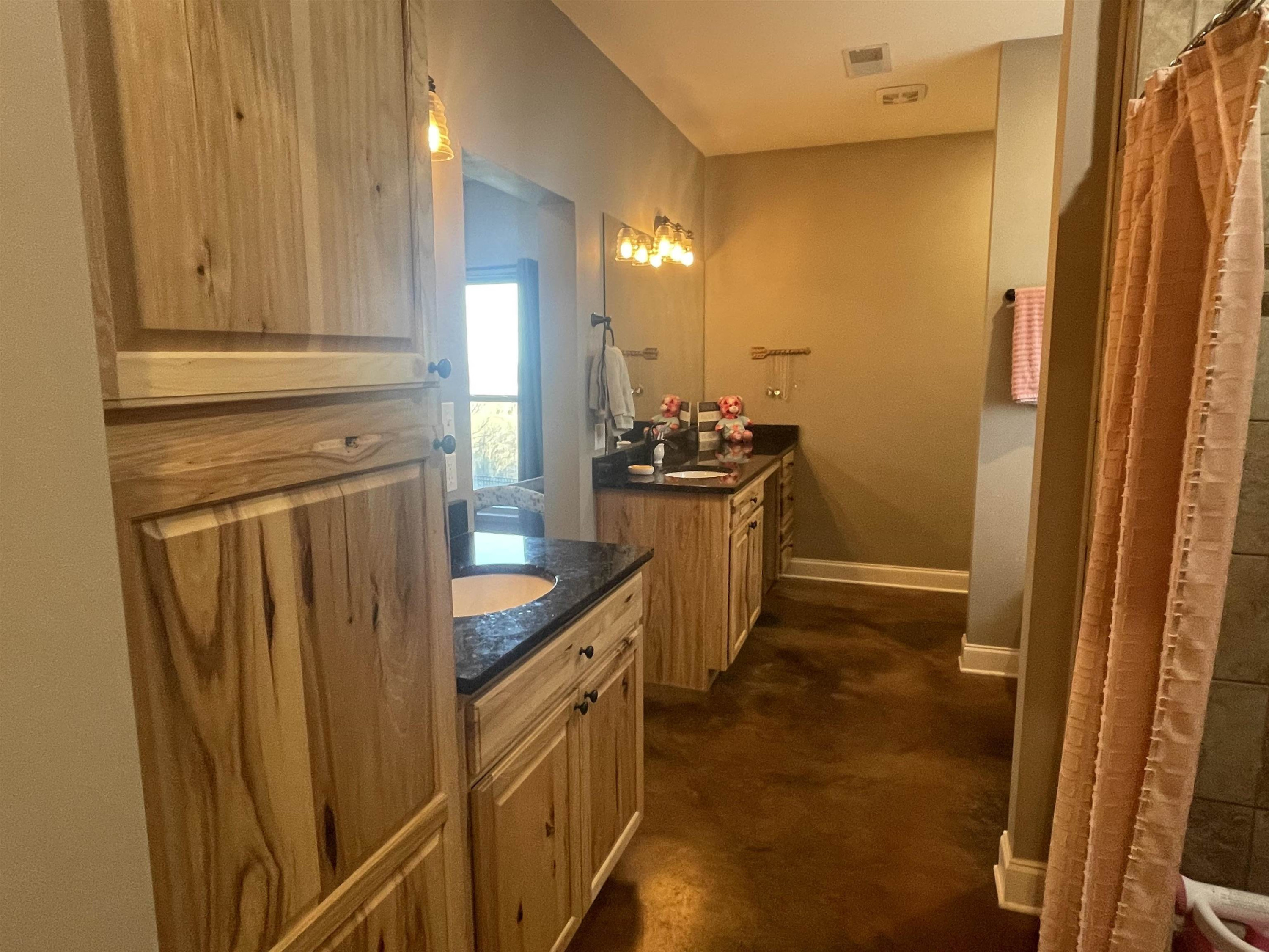 2680 Meacham Road Newbern, TN 38059 - Photo 10 of 13 a kitchen with sink a refrigerator and cabinets