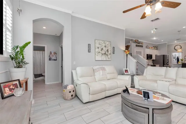 a view of a hallway with paintings on the door