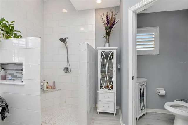 a bedroom with furniture and a baby crib