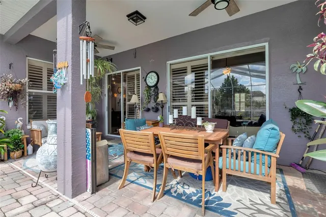 a view of a house with a yard and sitting area