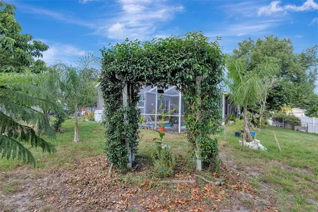 a swimming pool with outdoor seating and yard
