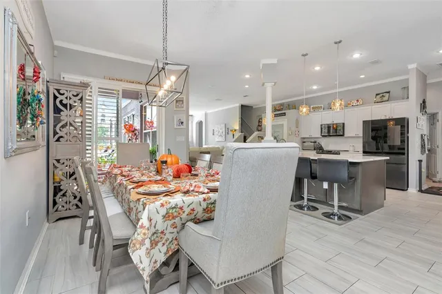 a large kitchen with a table and chairs in it