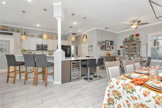 a view of a dining room with furniture and a book shelf