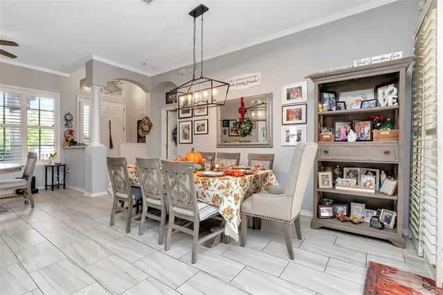 a view of a dining room with furniture window and outside view