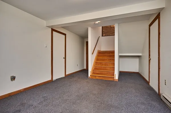 a view of a room with stairs and toys