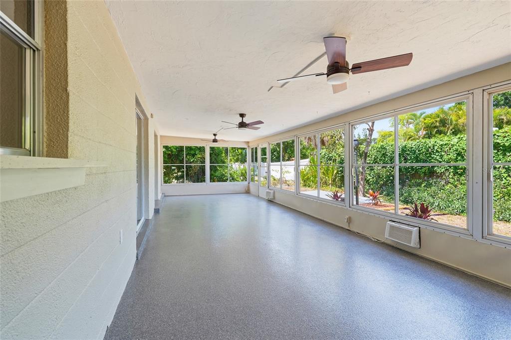 5984 Diana Road Venice, FL 34293 - Photo 17 of 36 a view of room with window and hardwood floor