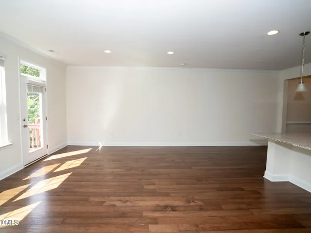 a kitchen with granite countertop stainless steel appliances and wooden cabinets