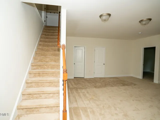 a view of a hallway with white walls