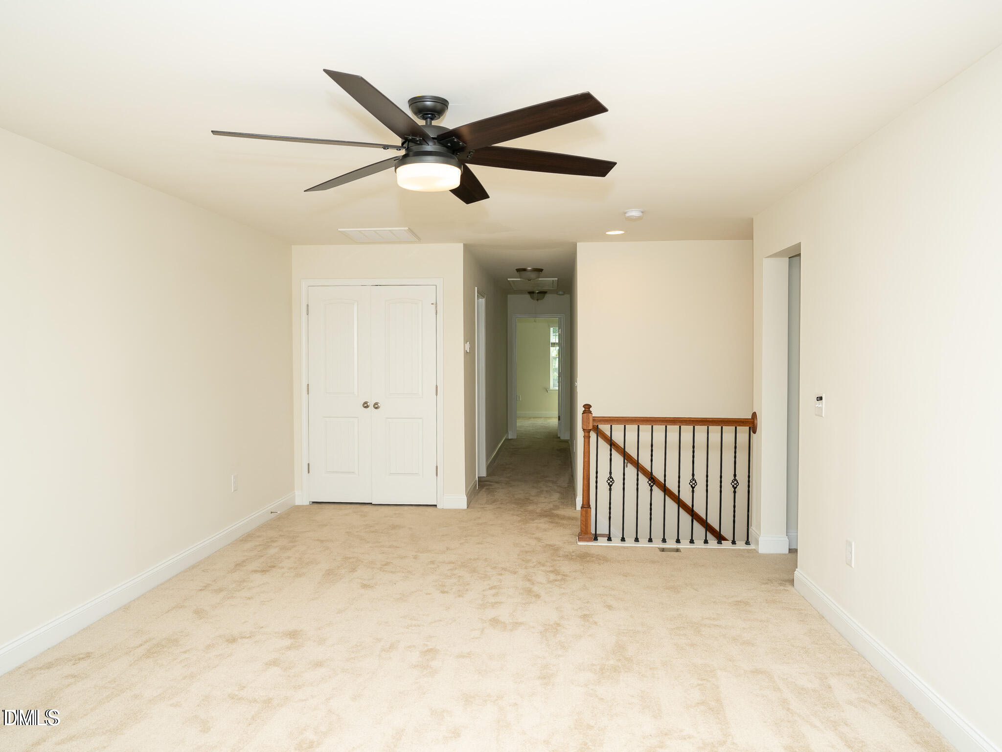 647 Newlyn Drive Raleigh, NC 27606 - Photo 32 of 53 a view of a hallway with a ceiling fan