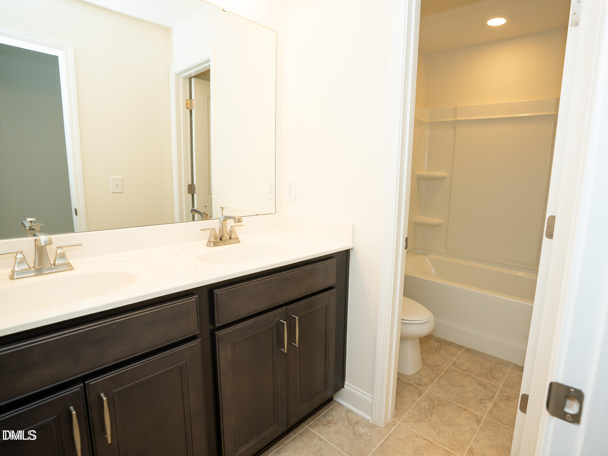 647 Newlyn Drive Raleigh, NC 27606 - Photo 35 of 53 a bathroom with a sink a toilet and shower
