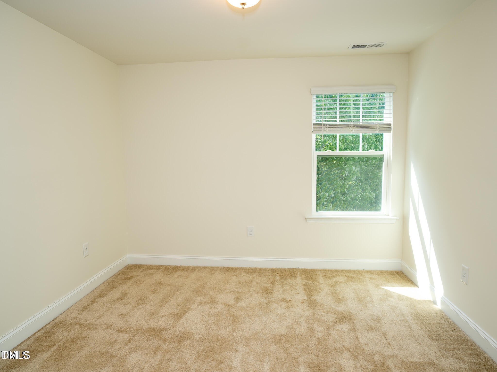 647 Newlyn Drive Raleigh, NC 27606 - Photo 41 of 53 an empty room with a window