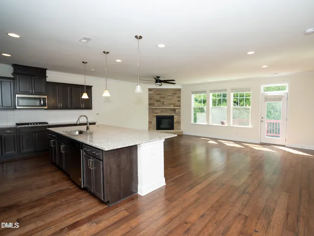 a large kitchen with stainless steel appliances