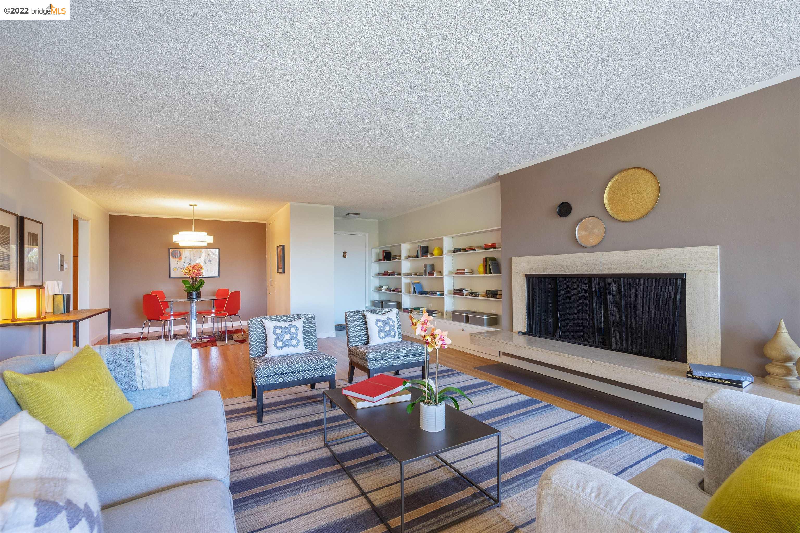 1401 Walnut Street, Unit 1A Berkeley, CA 94709 - Photo 1 of 1 a living room with furniture and a fireplace