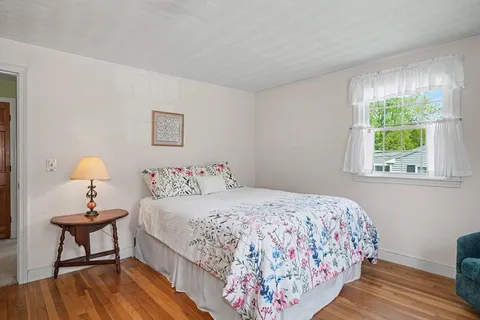 a bedroom with a bed and a table in it