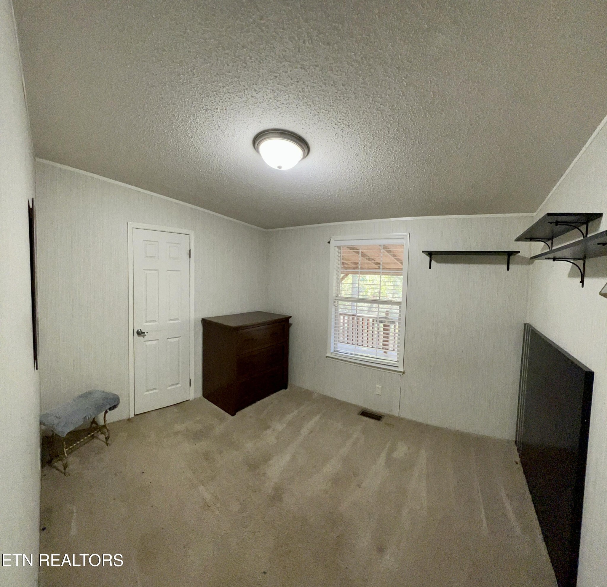 123 Doc Huling Road Robbins, TN 37852 - Photo 14 of 23 a view of an empty room with a window