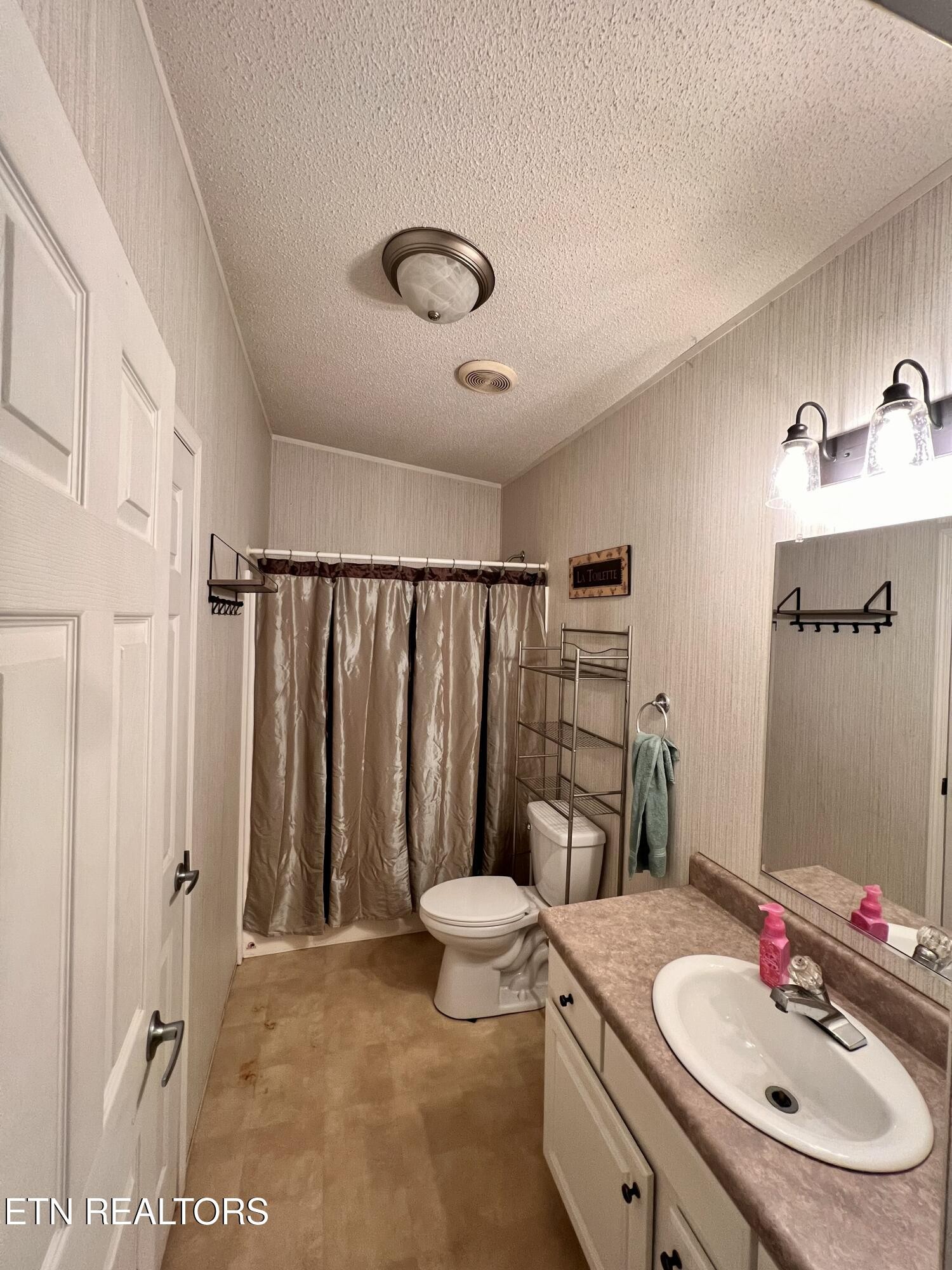 123 Doc Huling Road Robbins, TN 37852 - Photo 15 of 23 a bathroom with a sink toilet and shower