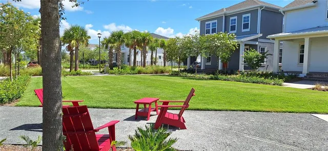 a view of a house with a yard and plants