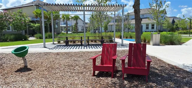 a view of a patio with a table and chairs