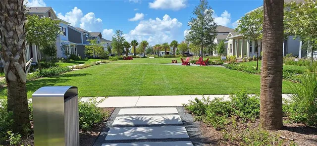 a view of a park with iron fence