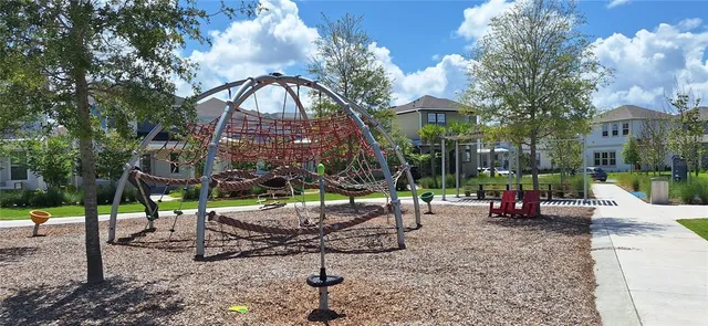 a view of swimming pool with a yard and plants