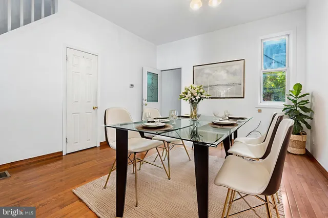 a view of a livingroom with furniture and a table