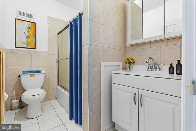 a bathroom with a sink toilet and vanity