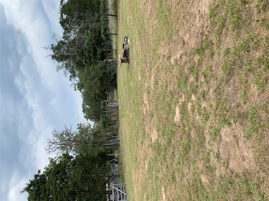 276 Ott Road Rosanky, TX 78953 - Photo 2 of 27 a view of a field with trees in the background