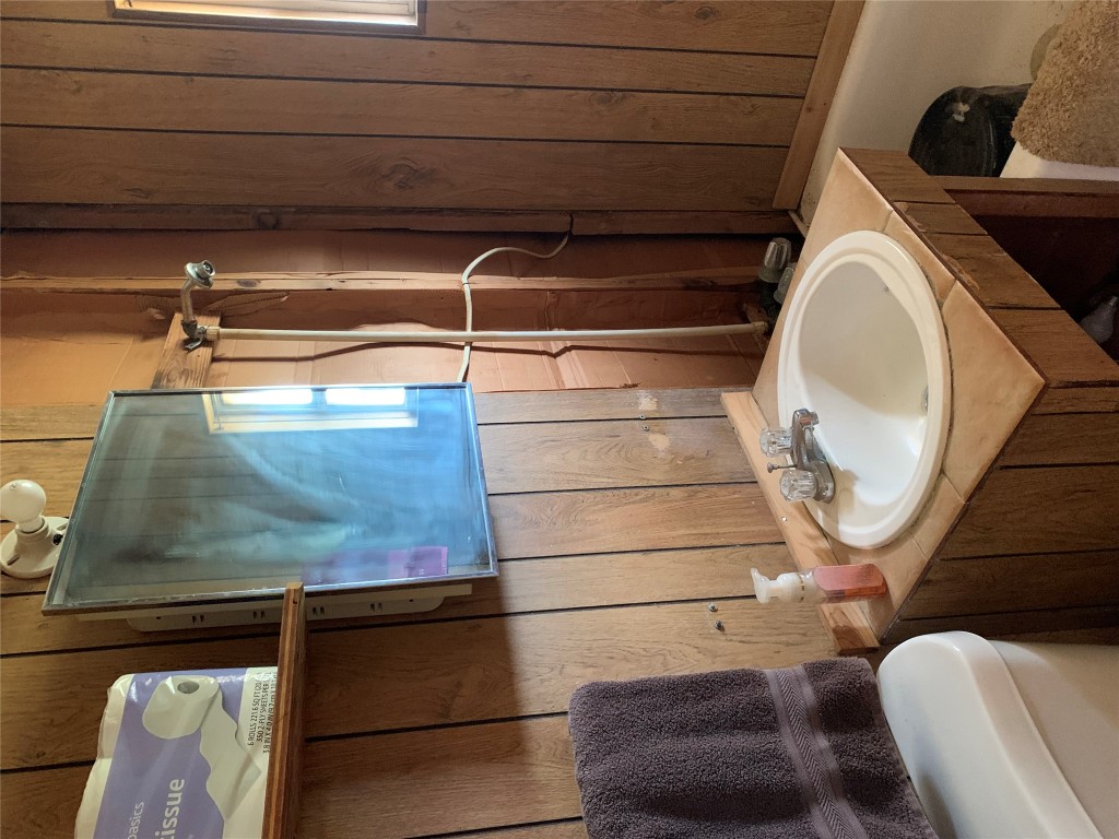 276 Ott Road Rosanky, TX 78953 - Photo 5 of 27 a bathroom with a sink and a mirror