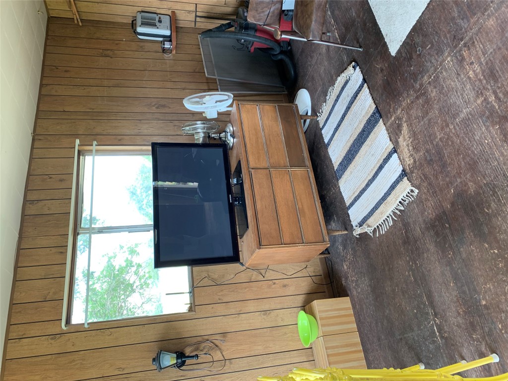 276 Ott Road Rosanky, TX 78953 - Photo 10 of 27 a living room with furniture a window and a flat screen tv