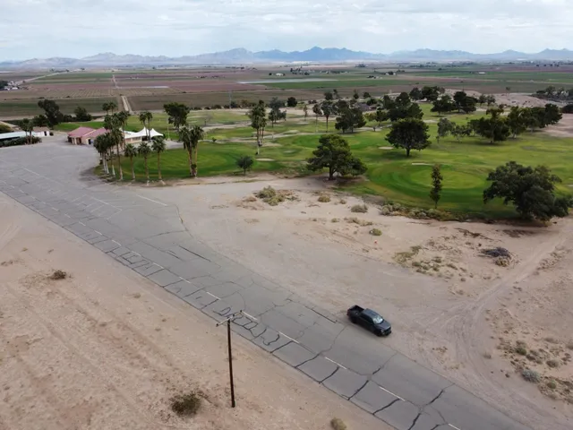 an aerial view of a yard with horses