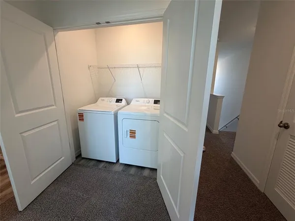 a utility room with dryer and washer