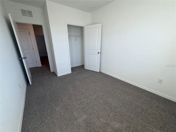 an empty room with staircase