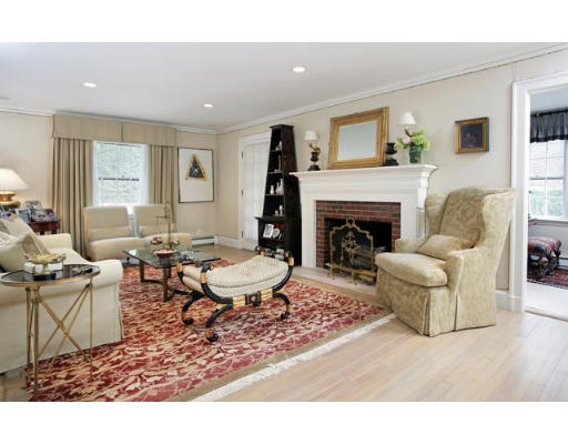 284 Dorset Road Newton, MA 02468 - Photo 2 of 10 a living room with furniture a fireplace and a table
