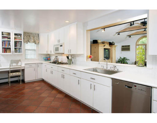 284 Dorset Road Newton, MA 02468 - Photo 4 of 10 a large white kitchen with a sink large mirror and cabinets