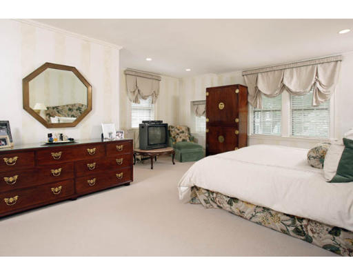 284 Dorset Road Newton, MA 02468 - Photo 6 of 10 a bedroom with a bed a mirror on dresser and a dresser