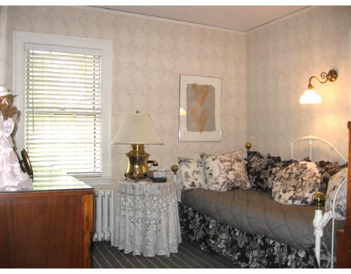 284 Dorset Road Newton, MA 02468 - Photo 8 of 10 a bedroom with a bed and a window