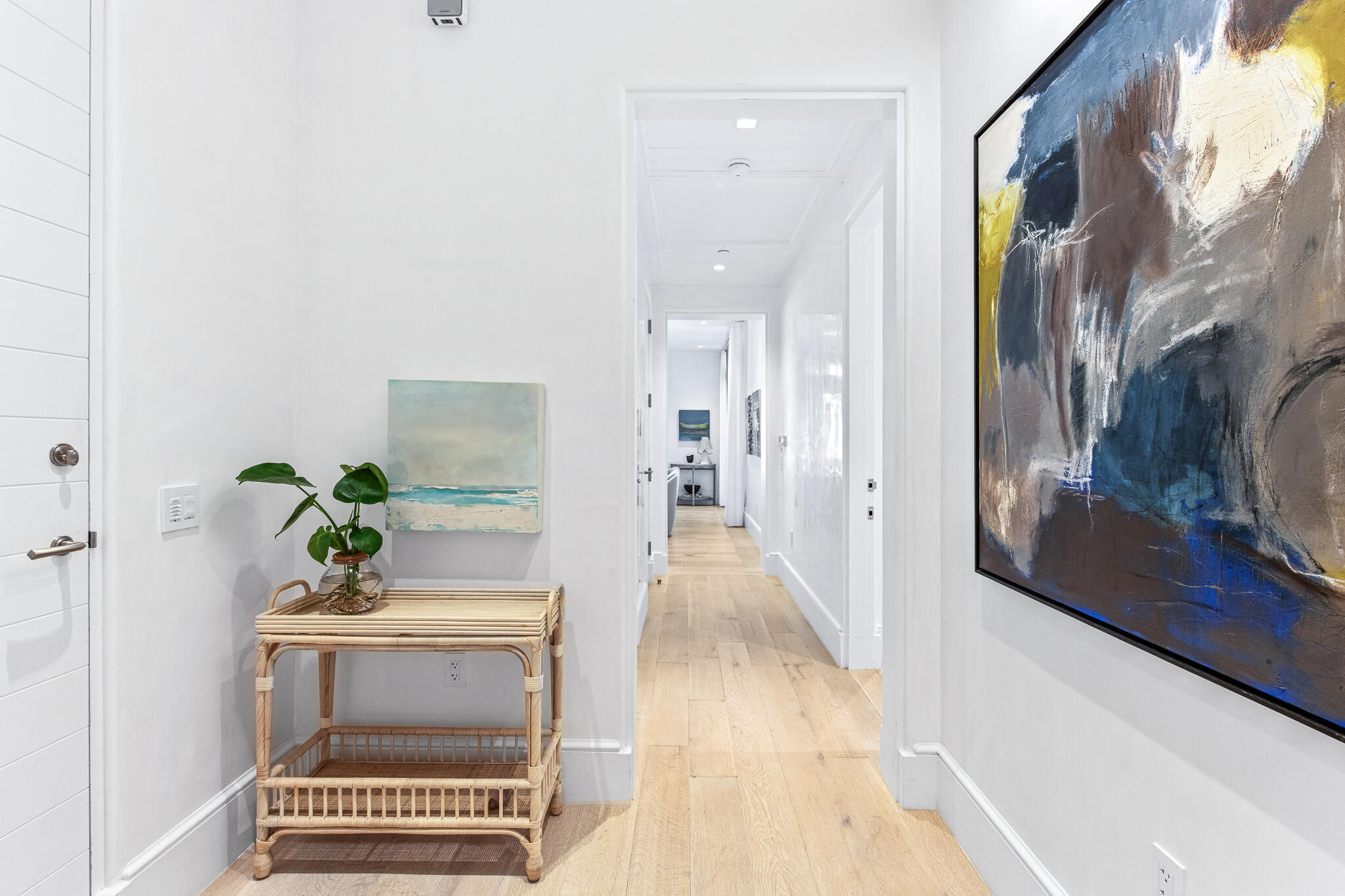 290 Sea Garden St Inlet Beach, Unit 201 Inlet Beach, FL 32461 - Photo 7 of 49 a view of a hallway with wooden floor and a potted plant