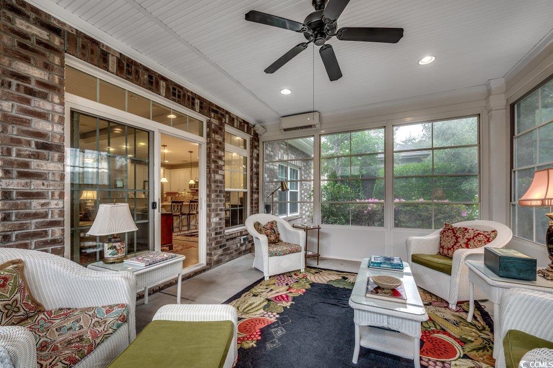 908 Corrado Street Myrtle Beach, SC 29572 - Photo 23 of 33 Sunroom with outdoor lounge area, a ceiling fan, and an AC wall unit