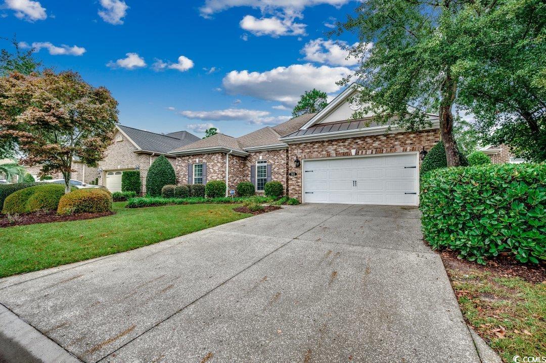 908 Corrado Street Myrtle Beach, SC 29572 - Photo 31 of 33 Ranch-style home featuring brick siding, driveway, a garage, and a front lawn