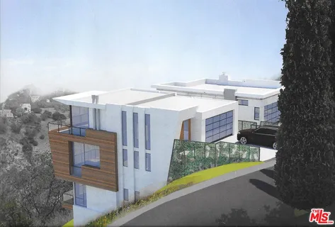 a view of a house with a small yard and large tree